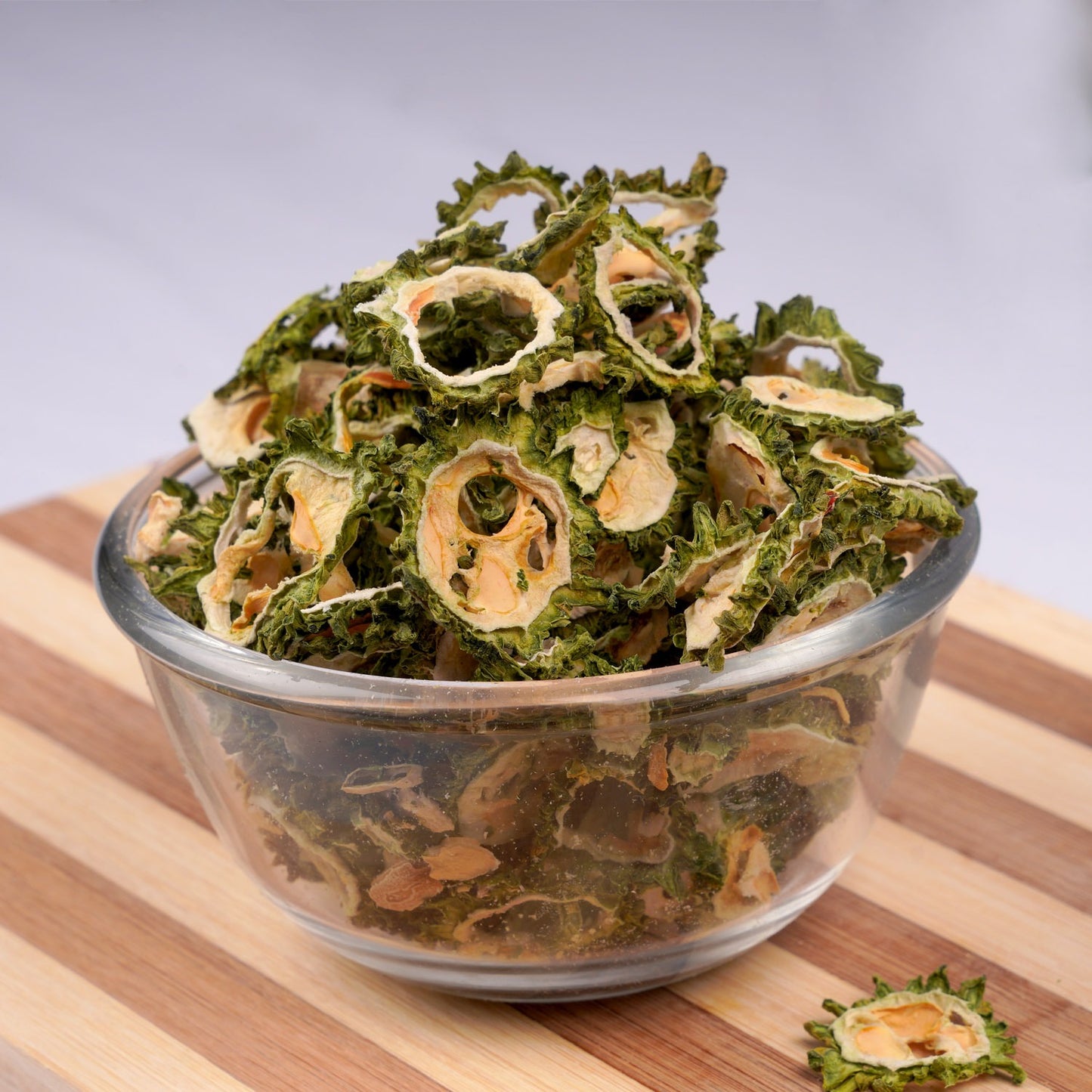 Dried vegetable pieces arranged on a rustic wooden surface