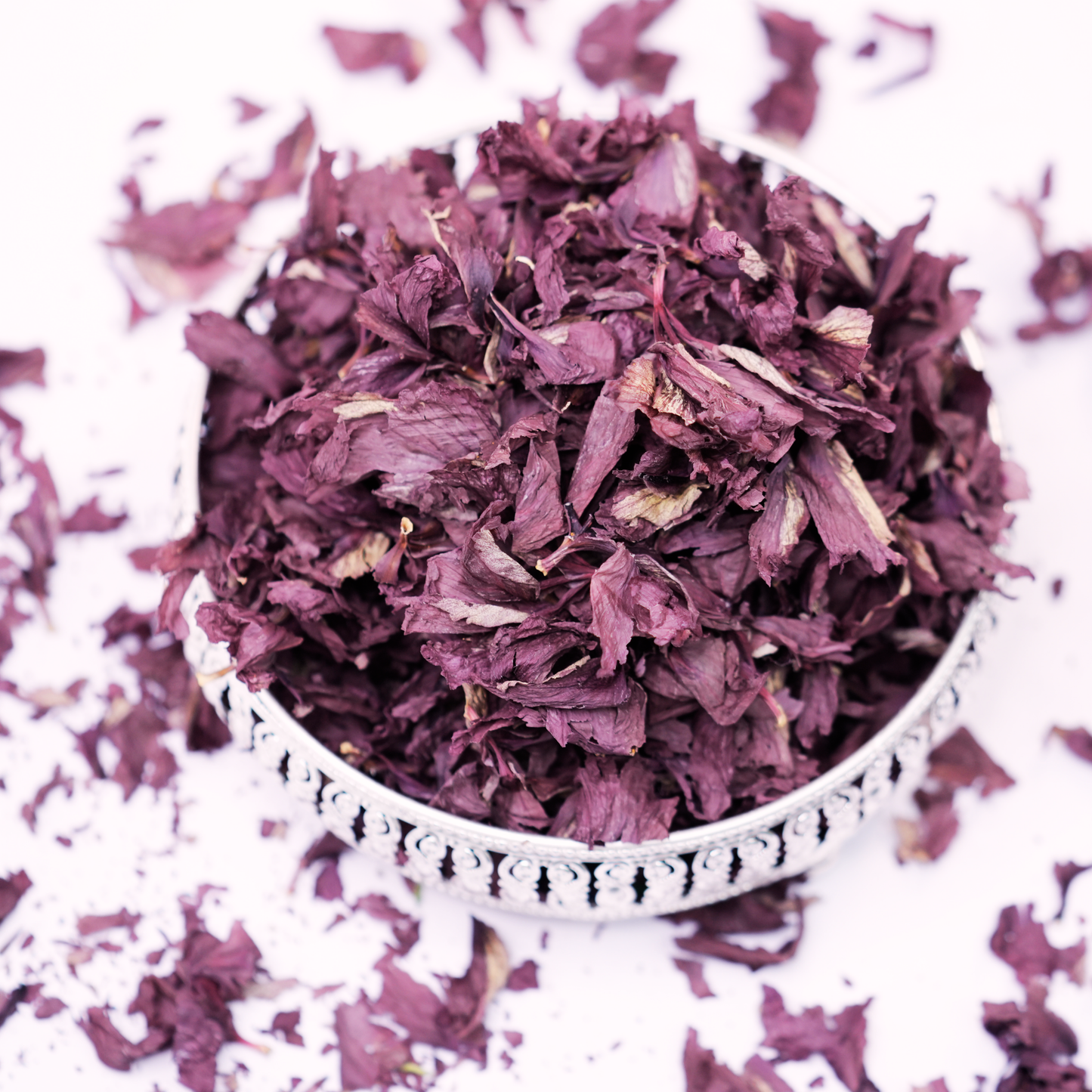 Brewed hibiscus flower water used as a natural nourishing hair rinse for scalp health and shine