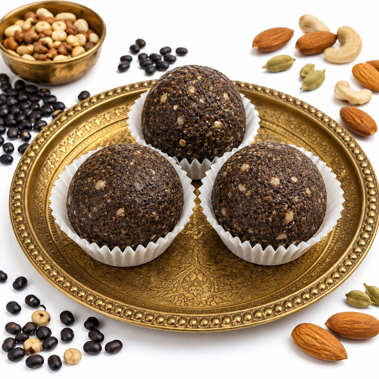 Traditional black urad dal ladoo served as a South Indian sweet