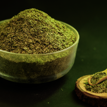 Close-up of precision T cut solar dried curry leaves showing cut texture and deep green colour