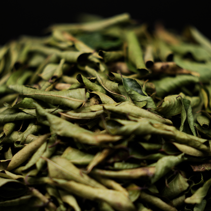 Solar dried curry leaves sizzling in hot oil for authentic South Indian tempering and tadka