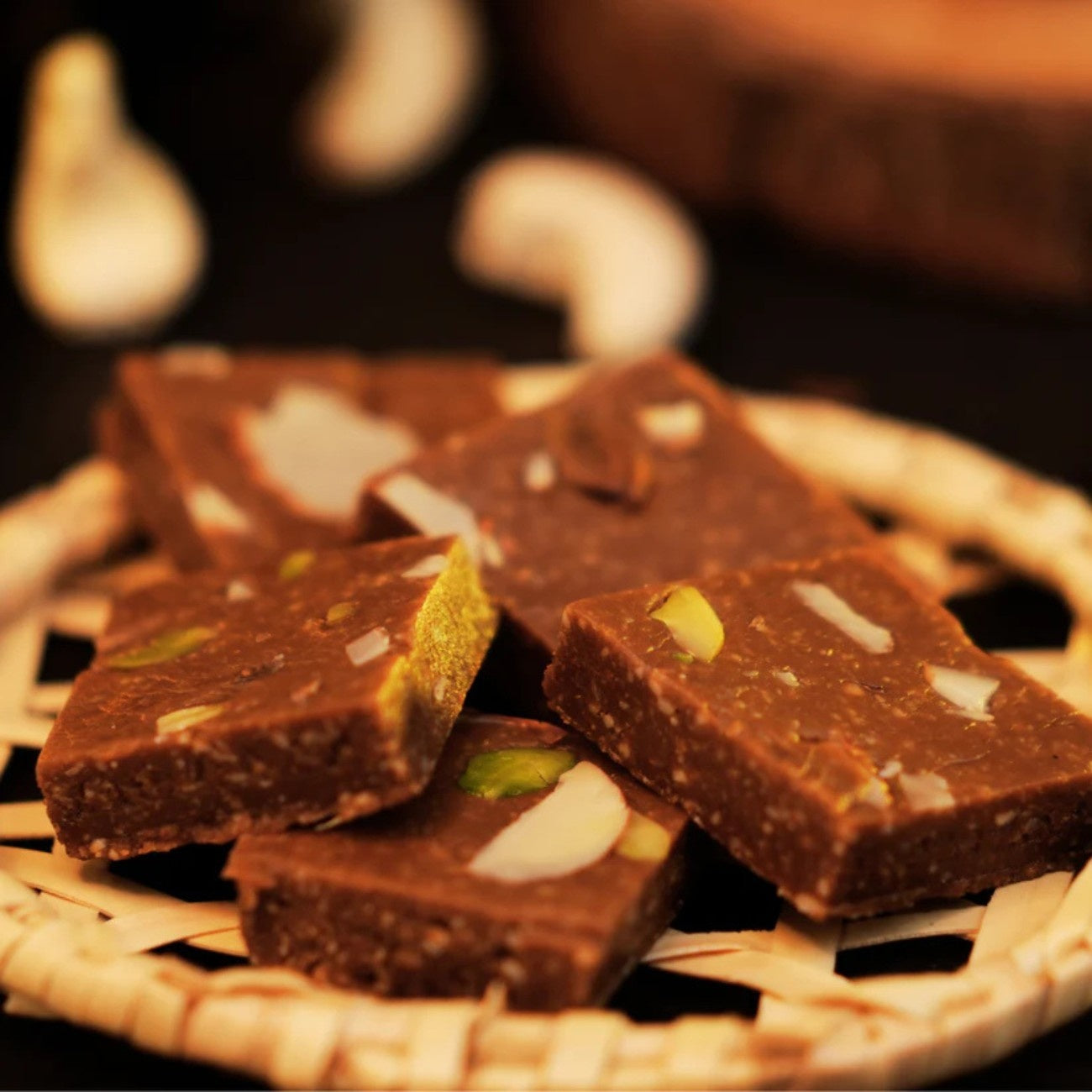 “Kaju katli thin diamond-shaped cashew sweet with silver leaf, premium Indian mithai”