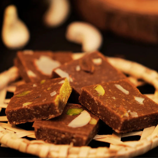 “Kaju katli thin diamond-shaped cashew sweet with silver leaf, premium Indian mithai”