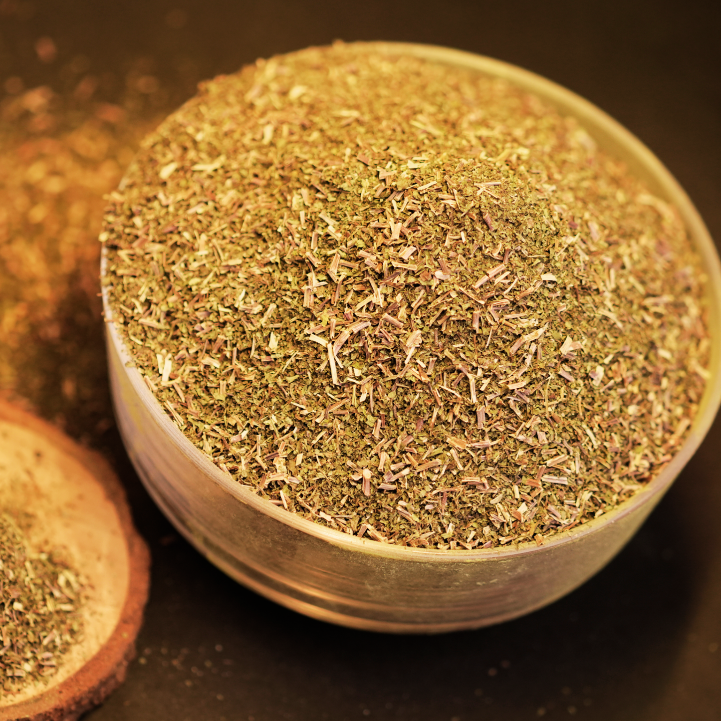 Solar dried mint leaves brewed as a fresh pudina herbal tea in a glass cup