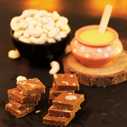Handcrafted kaju barfi enriched with natural molasses and iron-rich jaggery crystals.
